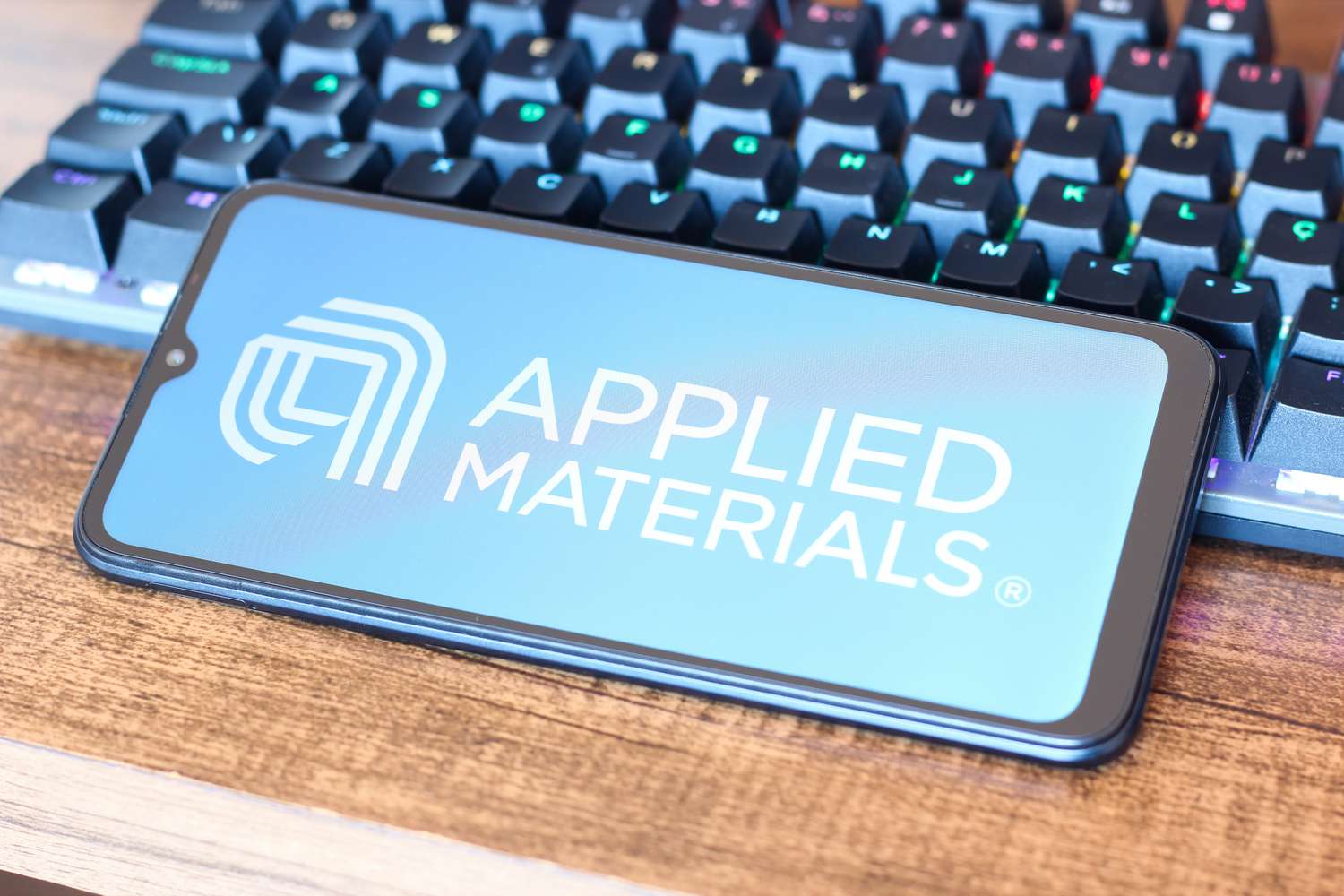 Applied Materials logo displayed on a smartphone screen.