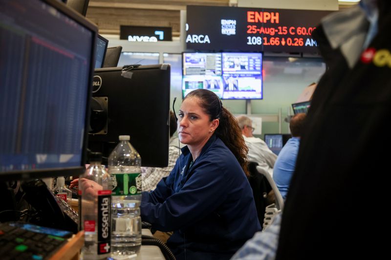 raders work on the floor of the New York Stock Exchange