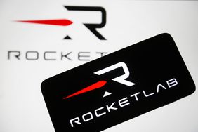 Rocket Lab logo is seen on a smartphone and on a PC screen