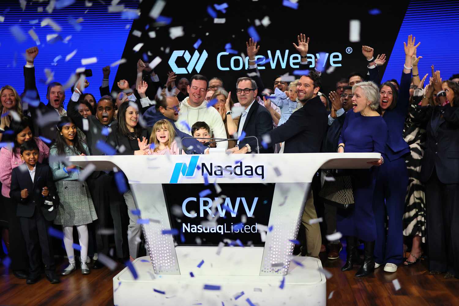 CoreWeave executives and others at Nasdaq headquarters Friday. 