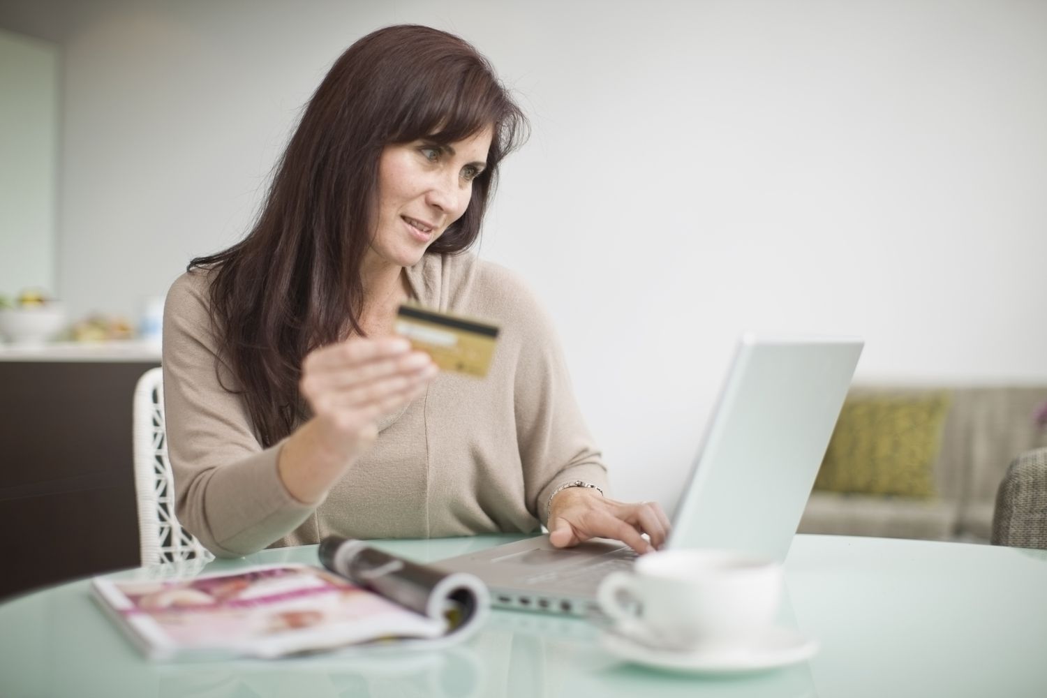 A credit card user checks her extended warranty feature.