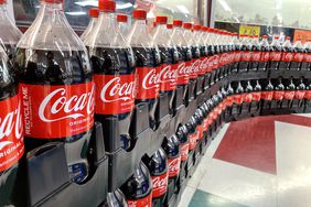 Rows of Coca-Cola bottles in a store