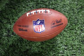 A practice ball with the NFL logo is seen on the field during the first quarter of an NFL preseason football game between the Pittsburgh Steelers and the Detroit Lions on August 24, 2024 at Ford Field in Detroit, Michigan