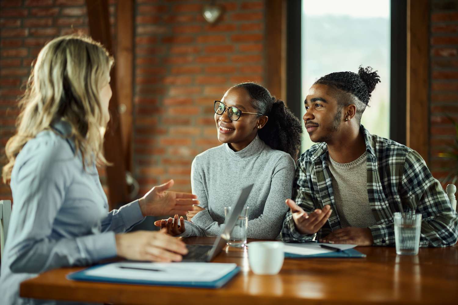 Three people talking in an office