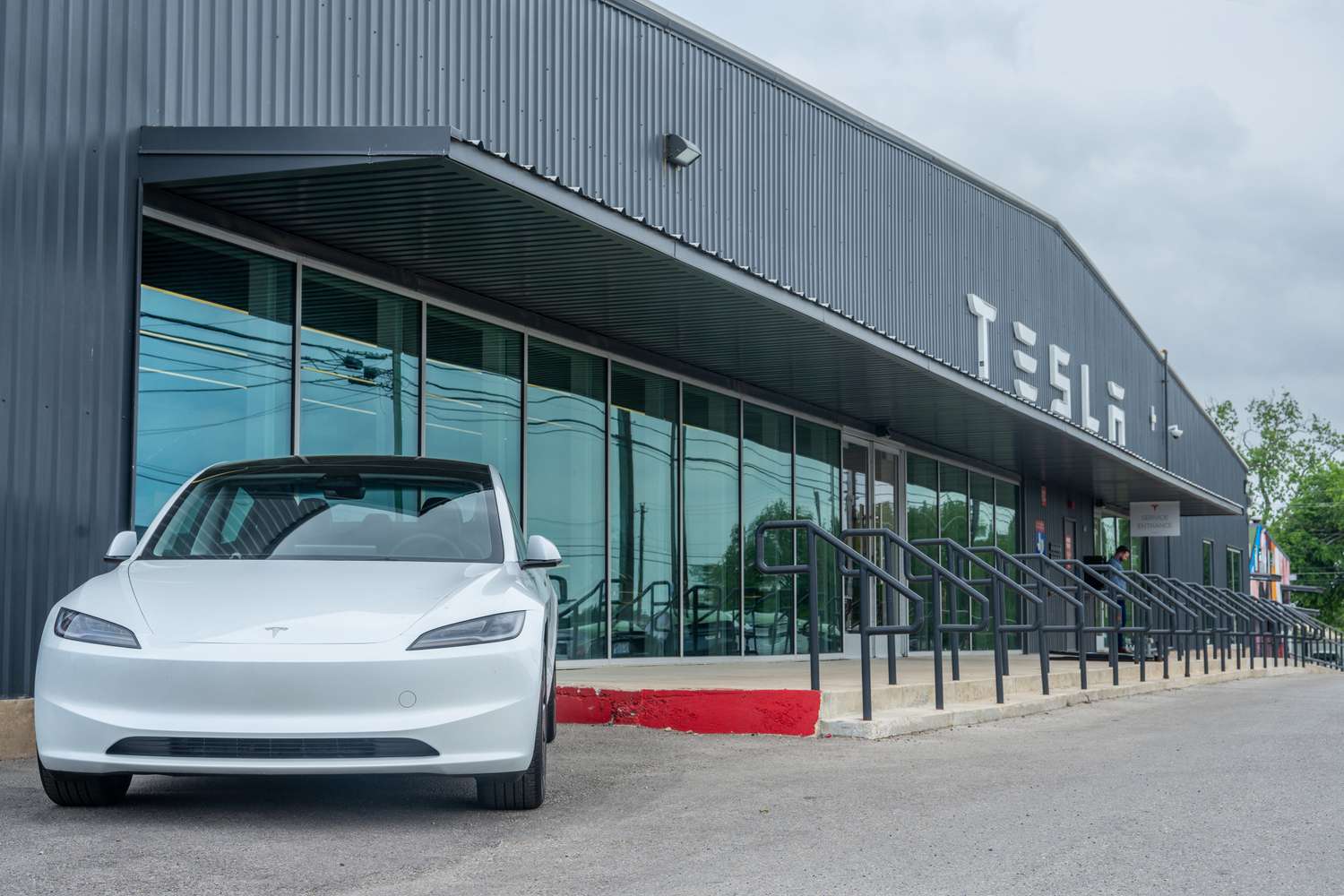 A Tesla Model Y sits on the lot at a Tesla dealership in Austin, Texas. 
