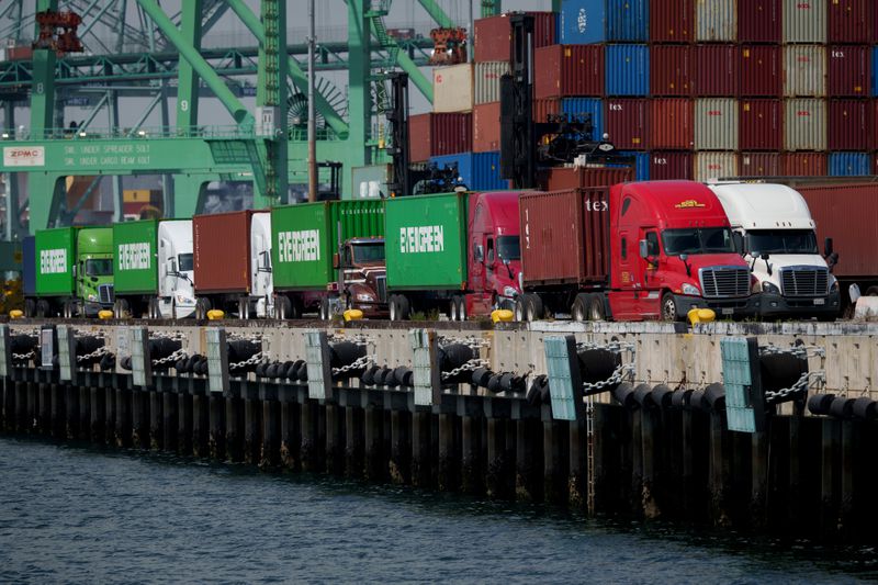 Trucks and shipping containers at the Port of Los Angeles in Los Angeles, California, US, on Thursday, April 24, 2025.