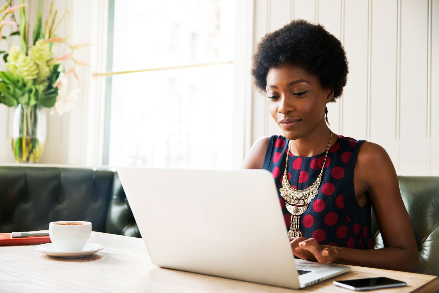 Woman reviews the home equity prepayment (HEP) curve for her mortgage on her laptop