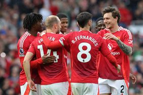 Manchester United's Danish midfielder #14 Christian Eriksen (2L) celebrates with teammates after scoring their second goal from the penalty spot during the English Premier League football match between Manchester United and Aston Villa at Old Trafford in Manchester, north west England, on May 25, 2025