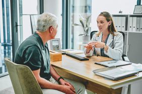 Shot of a young doctor having a consultation with her elderly patient