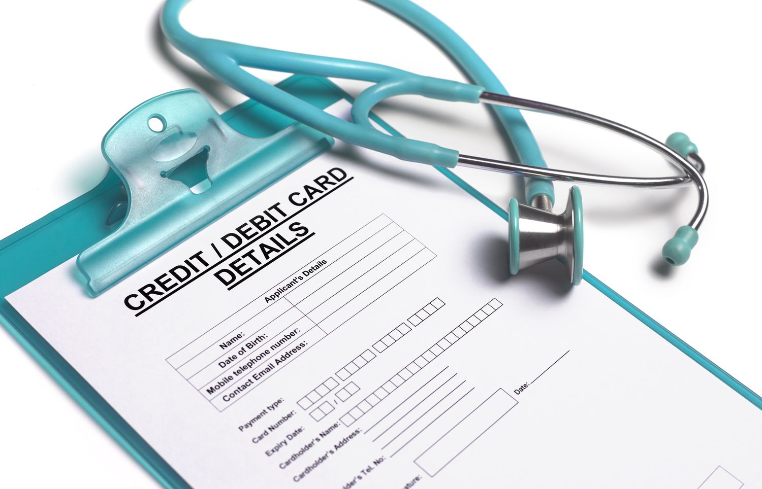 a stethoscope sitting on a form to take patient's credit card payment details