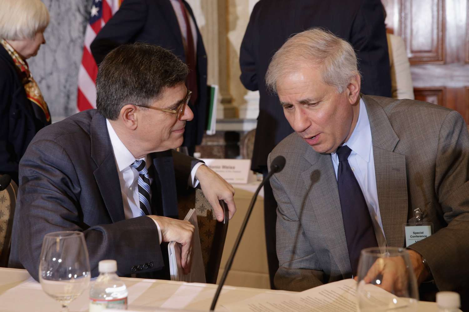 Former U.S. Treasury Secretary Jacob Lew (L) and Federal Deposit Insurance Corporation Chairman Martin Gruenberg visit at the conclusion of a meeting of the Financial Stability Oversight Council at the Treasury Department, April 13, 2016 in Washington, DC. 