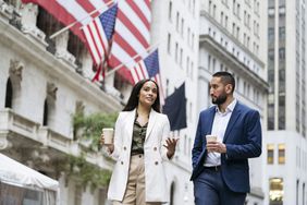 Two colleagues walk outside