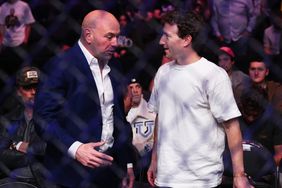 Mark Zuckerberg and Dana White talk at a UFC event.