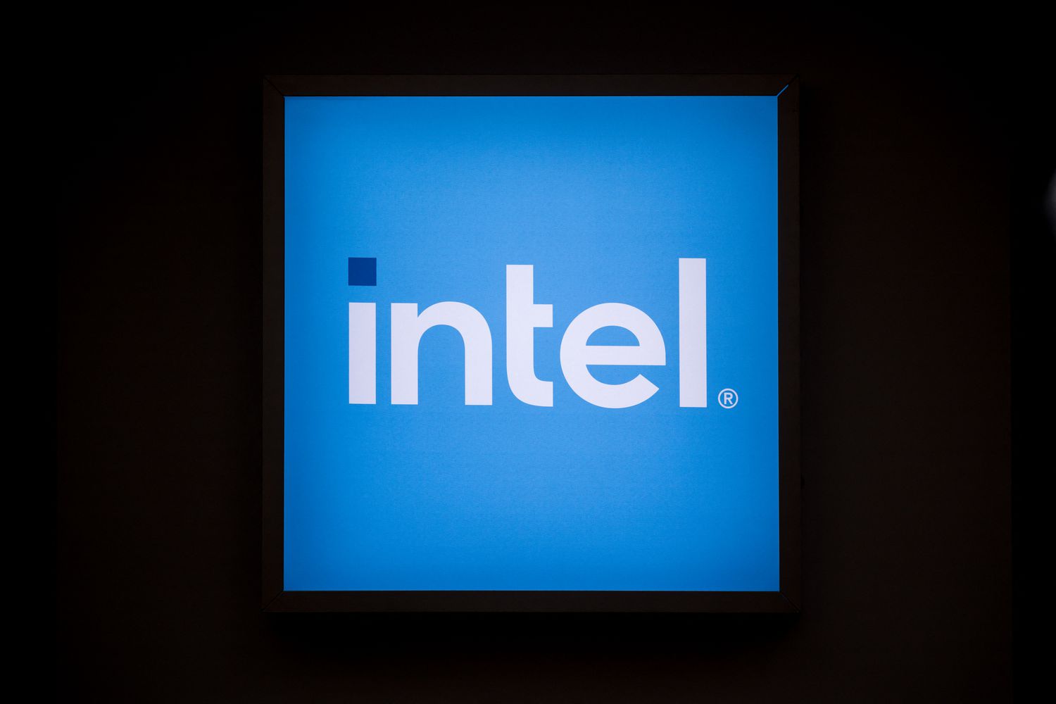 The Intel logo on display at a conference. 