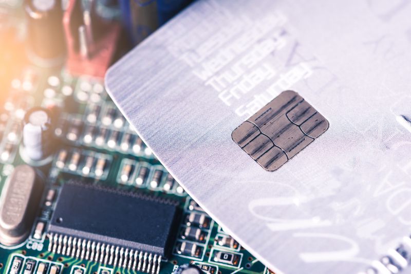 A credit card placed on the computer's motherboard.