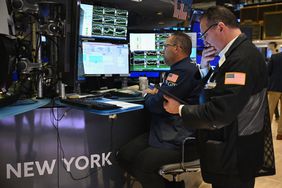 Traders work on the floor of the New York Stock Exchange (NYSE) at the opening bell on November 13, 2024