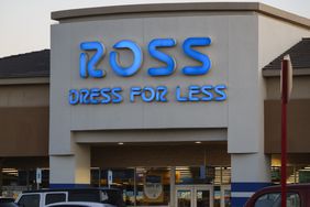 The blue Ross Dress for Less logo is seen above the entrance to a store.
