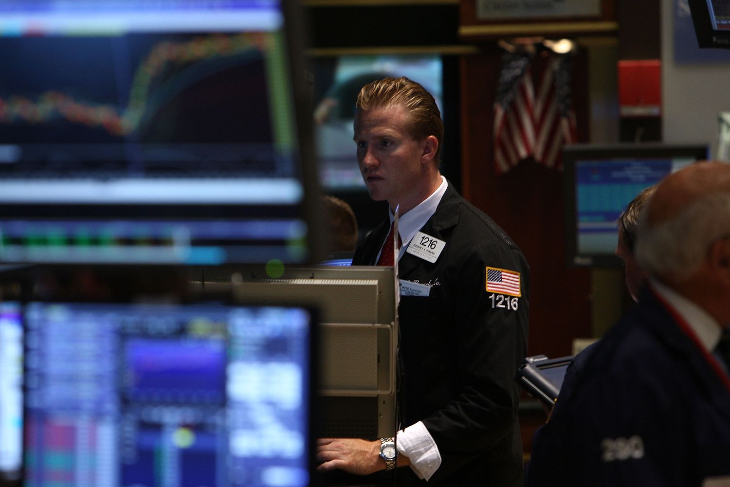 A New York Stock Exchange floor trader uses a computer to track stock trades.