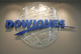 The logo for Dow Jones & Company appears on an office wall.