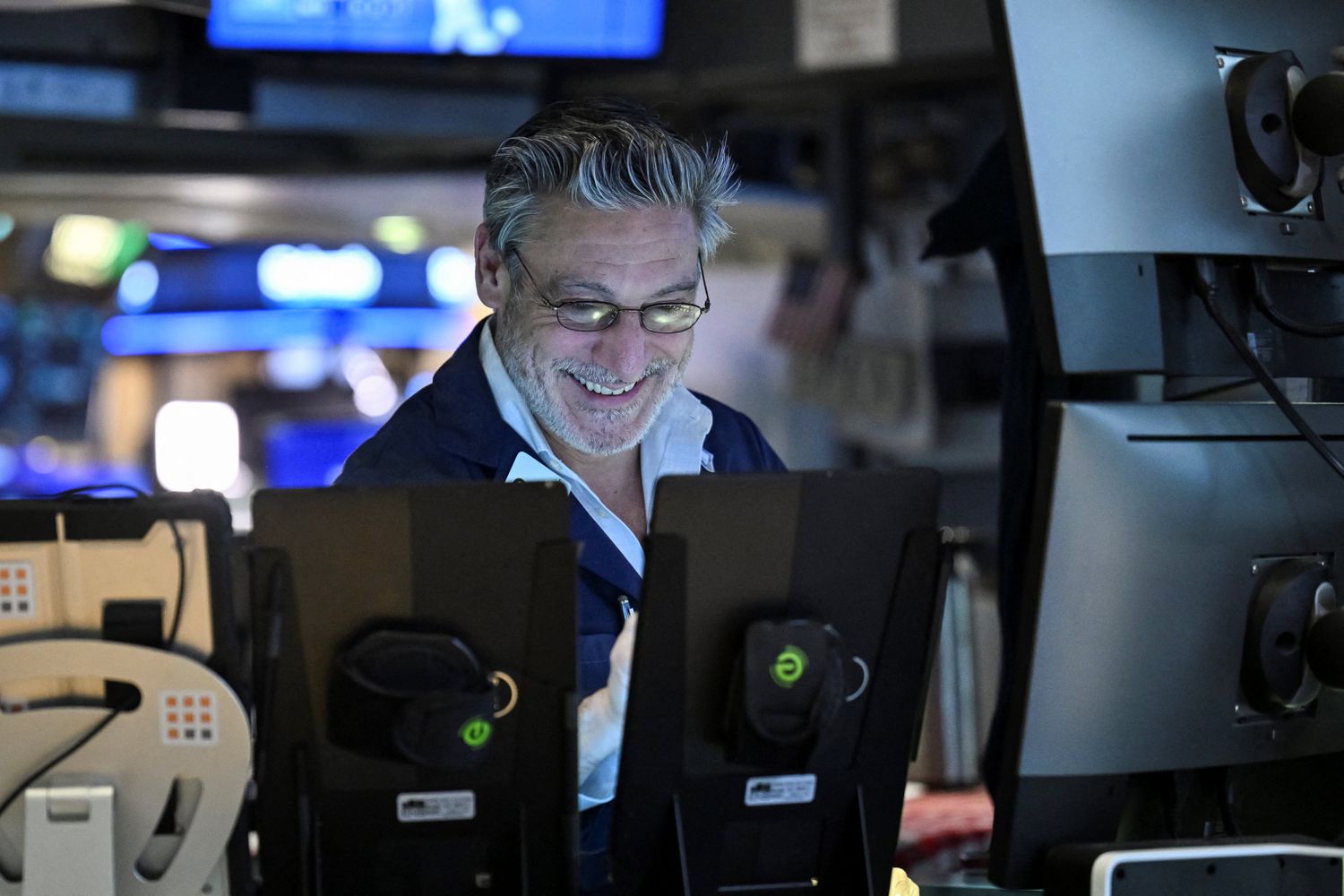 A trader works on the floor of the New York Stock Exchange (NYSE) during afternoon trading on April 9, 2025 in New York.