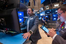 Traders work on the New York Stock Exchange (NYSE) floor