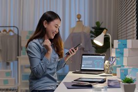 An entrepreneur works at a desk.