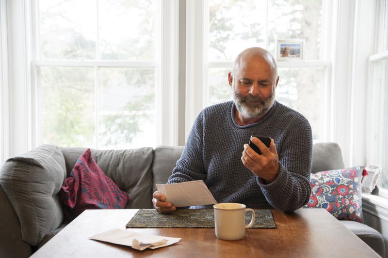 Man looking at bills