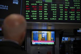 A television station broadcasts US Federal Reserve Chair Chair Jerome Powell speaking in Jackson Hole, Wyoming, on the floor of the New York Stock Exchange (NYSE) in New York on August 23, 2024. 