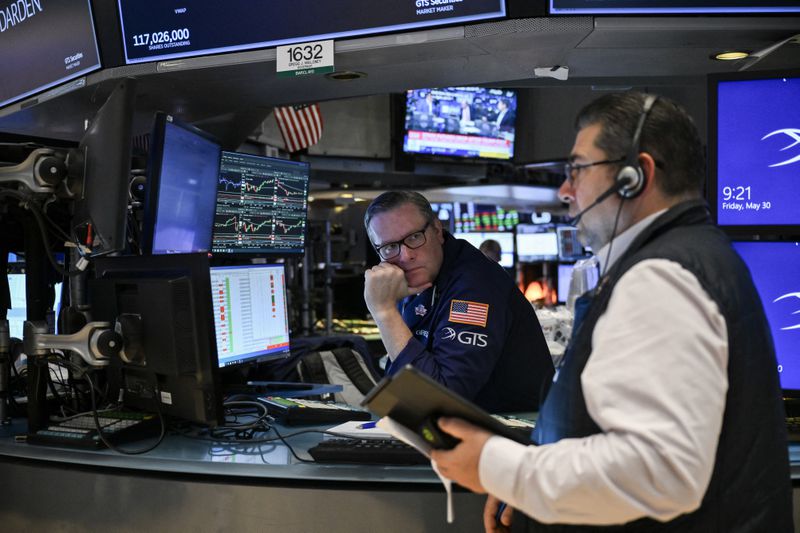 Traders work on the floor of the New York Stock Exchange (NYSE) at the opening bell on May 30, 2025, in New York City. 