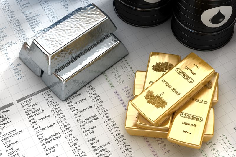 Silver and Gold Ingots on the Desk with Financial Documents