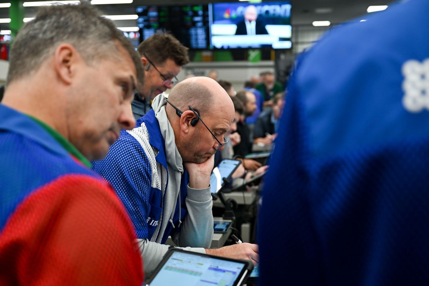 Traders work in the options pit at the Cboe Global Markets exchange