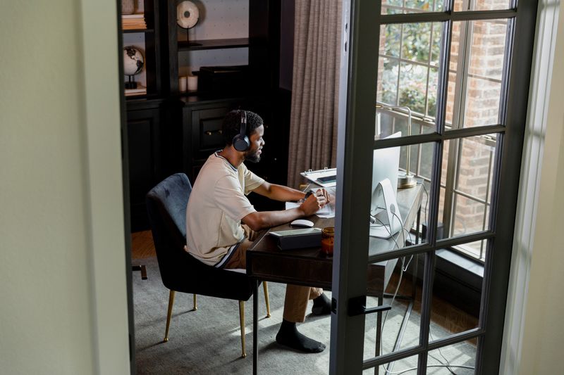 High angle view of mid adult man working from home