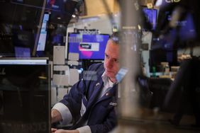 A trader works on the floor at the New York Stock Exchange.