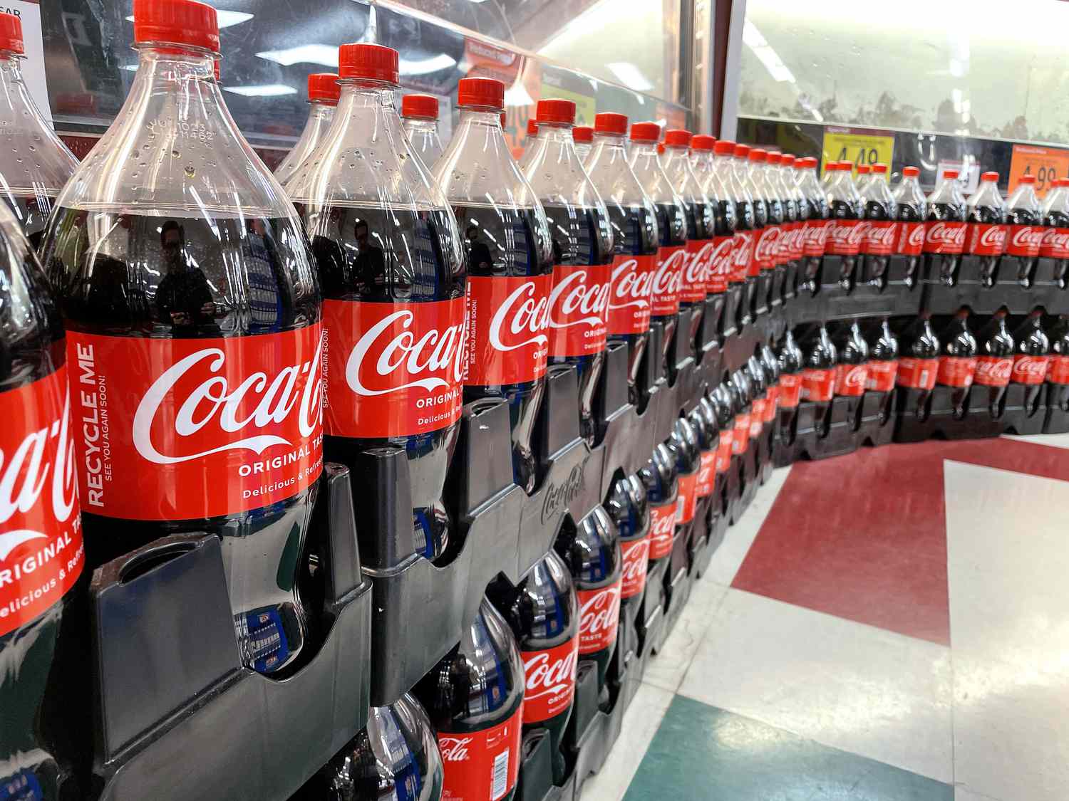 Rows of Coca-Cola bottles in a store