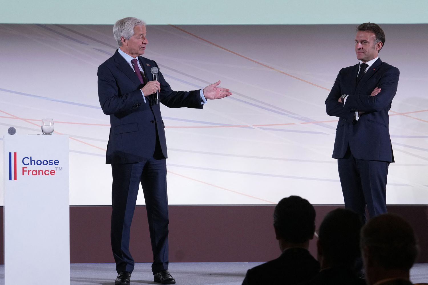 France's President Emmanuel Macron (R) and JPMorgan Chase CEO Jamie Dimon take part in the Global Markets Conference, ahead of the Choose France summit, in Paris, on May 15, 2025.