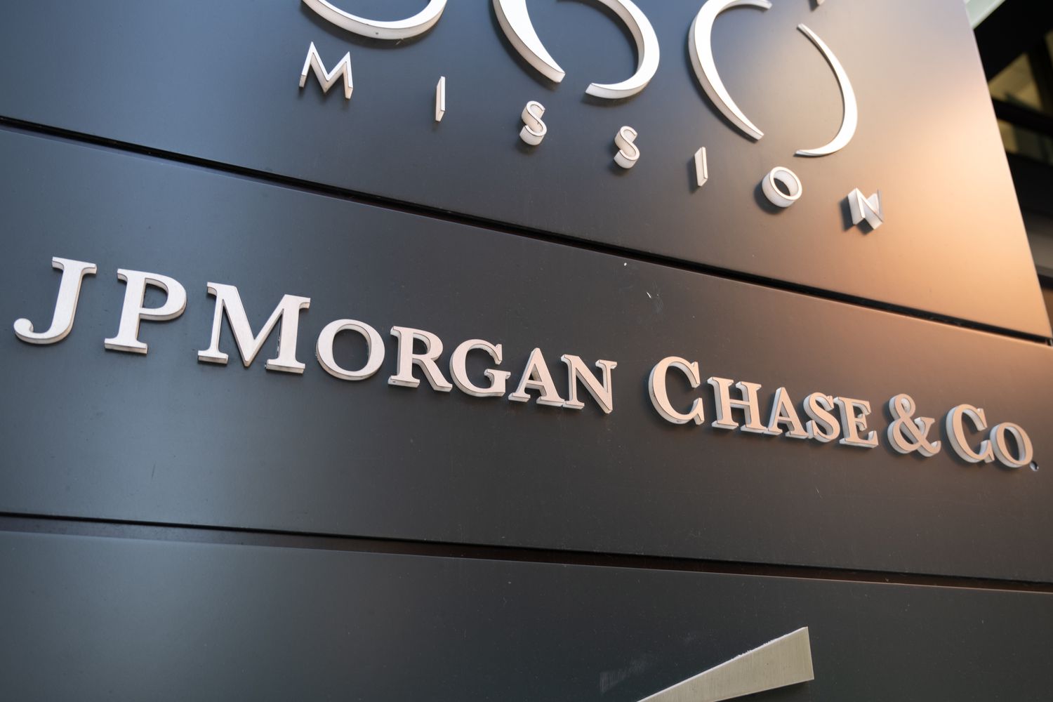 The JPMorgan Chase & Co. logo is seen on a black sign outside an office building.
