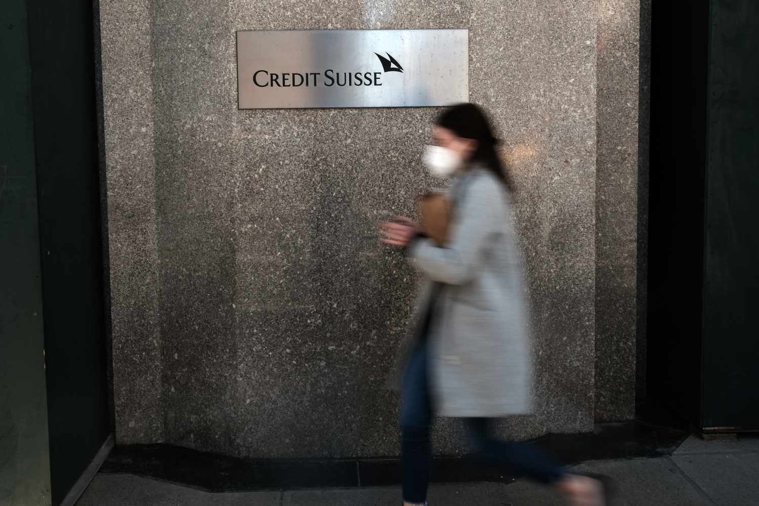 A woman walks by the Credit Suisse offices on March 29, 2021 in New York City