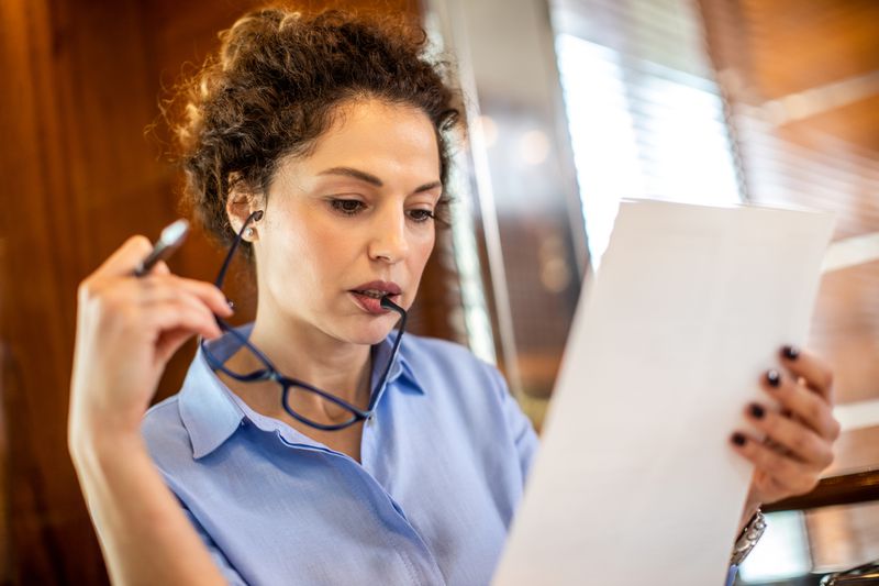 businesswoman reading a paper document