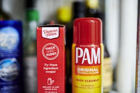 A box of Duncan Hines brownie mix sits next to a bottle of Pam cooking spray