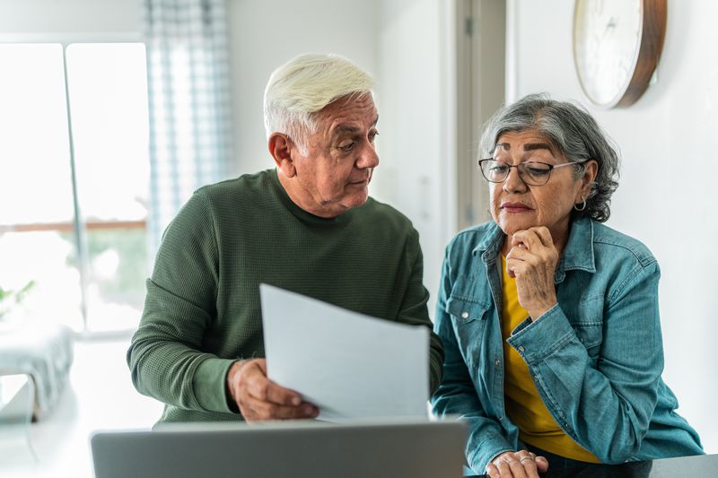 A couple looking at a piece of paper
