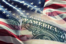 American flag with United States dollar bill
