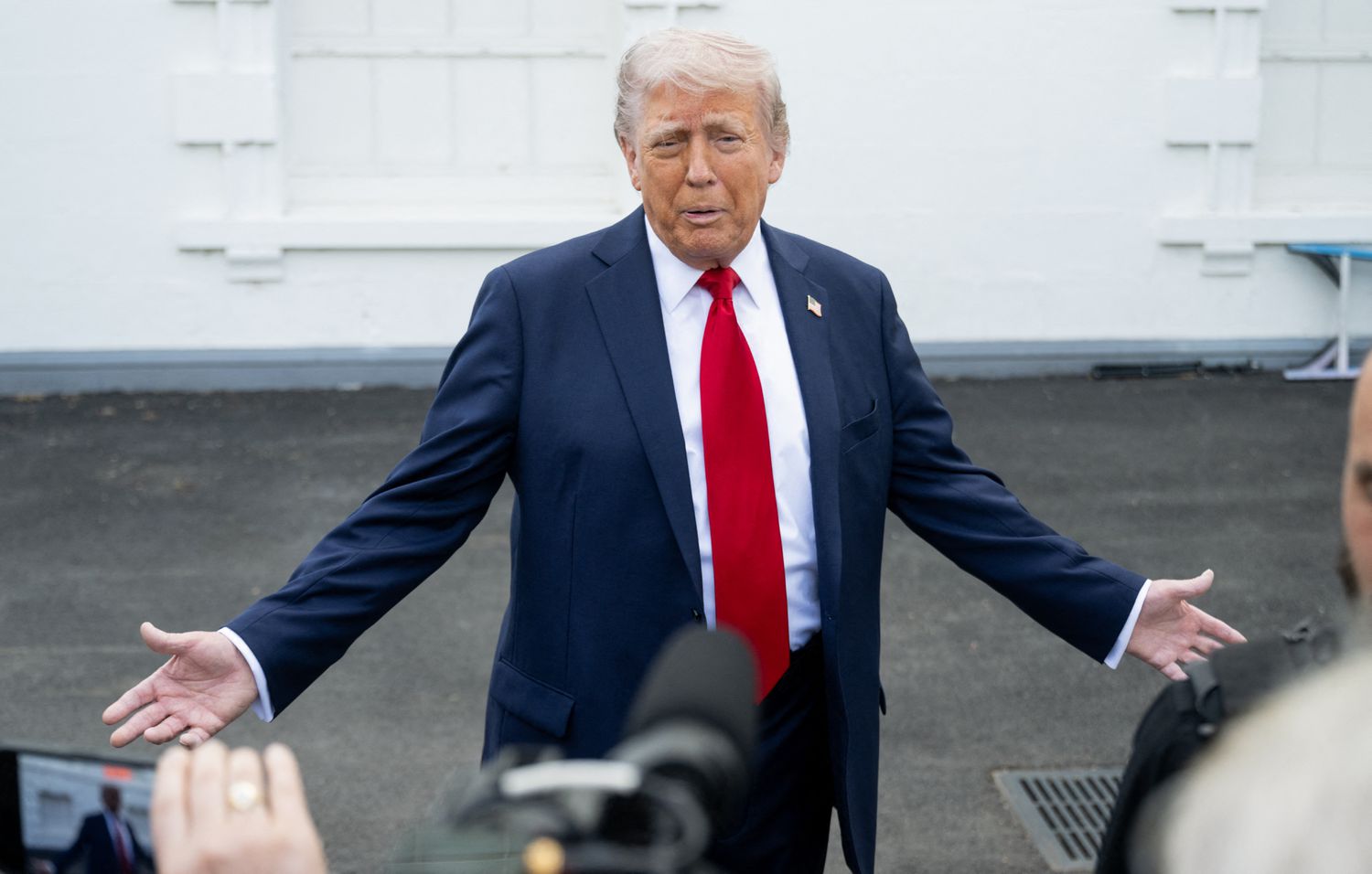 US President Donald Trump speaks with reporters outside the White House in Washington, DC, on April 23, 2025.