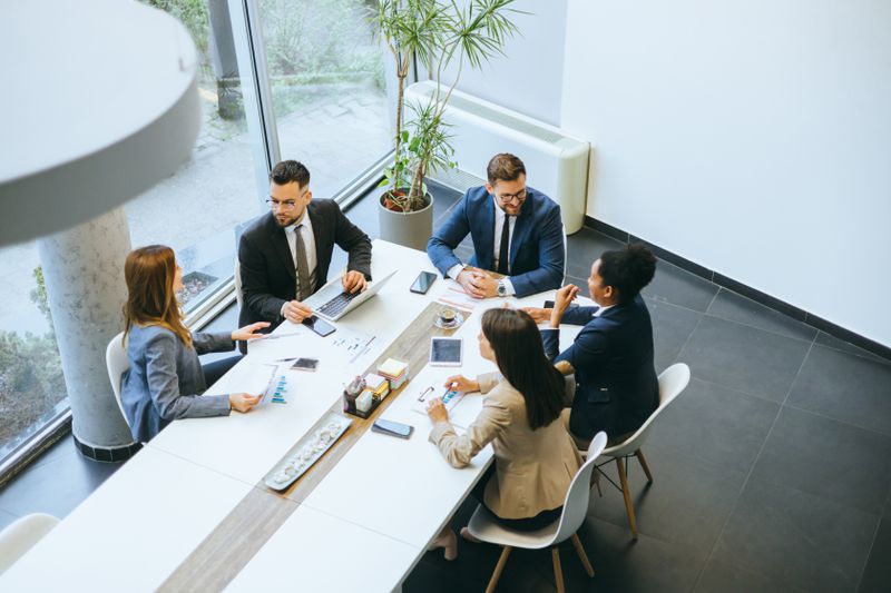 Business colleagues collaborate on a project at a conference table in a modern office