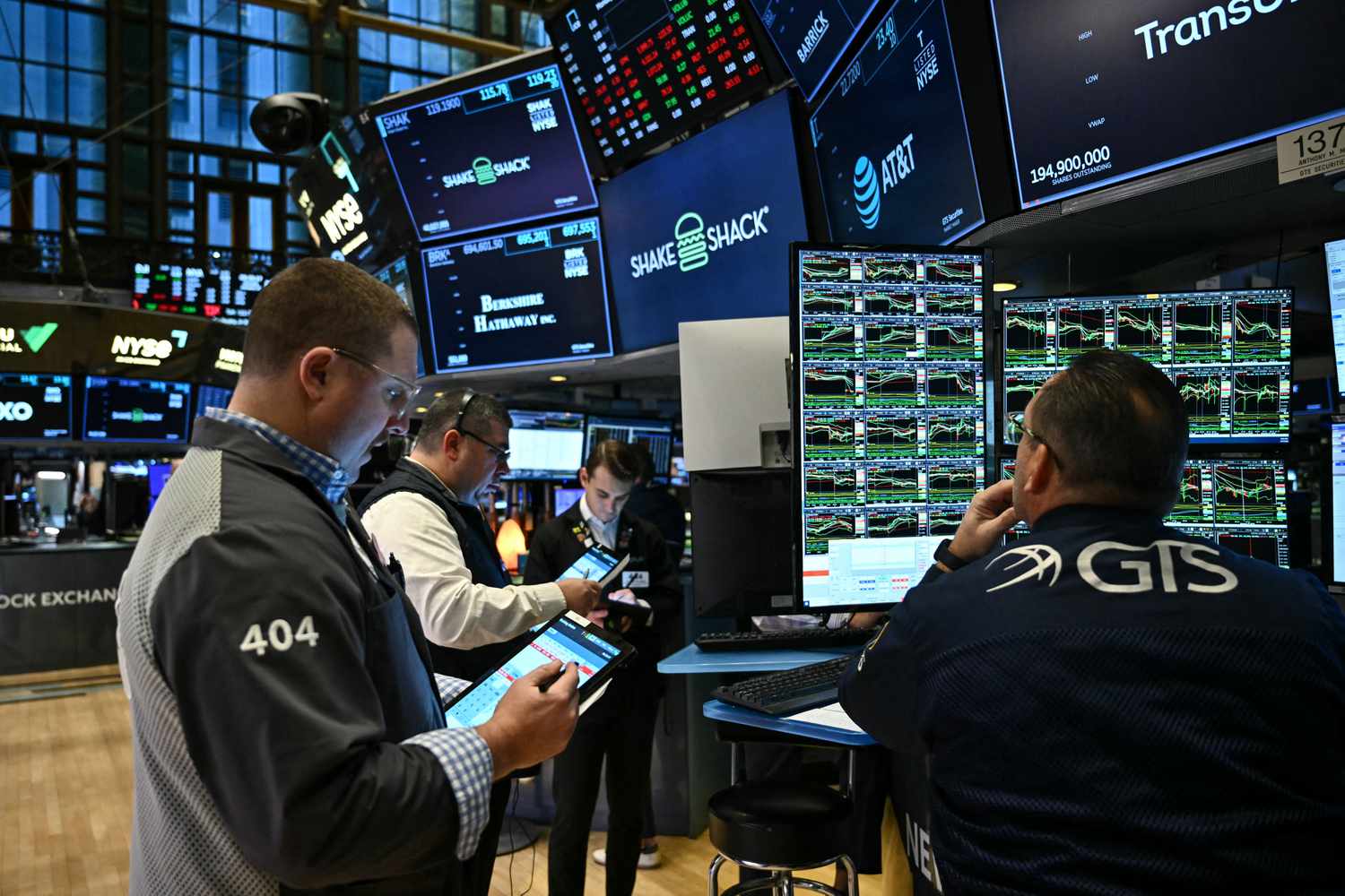 Traders and financial professionals work on the floor of the New York Stock Exchange (