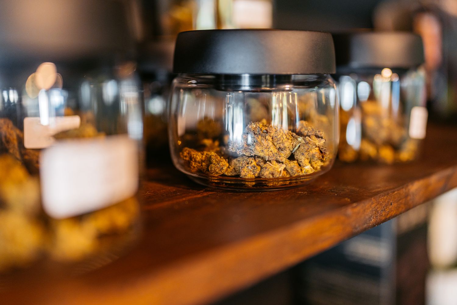 Jars of marijuana on a counter top.
