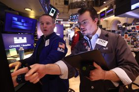 Traders work on the floor of the New York Stock Exchange.