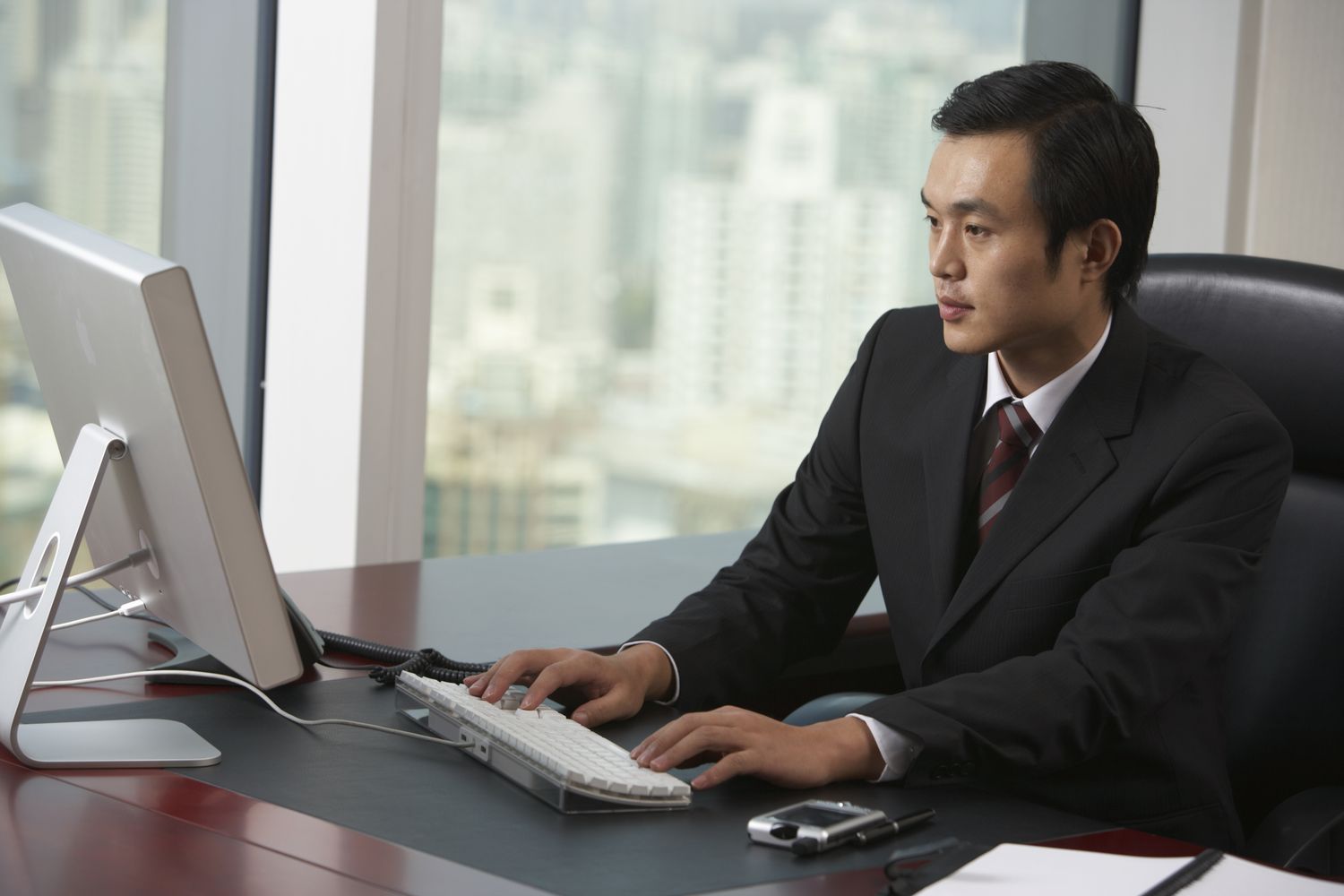Employer writing up an employee buyout (EBO) offer on their computer