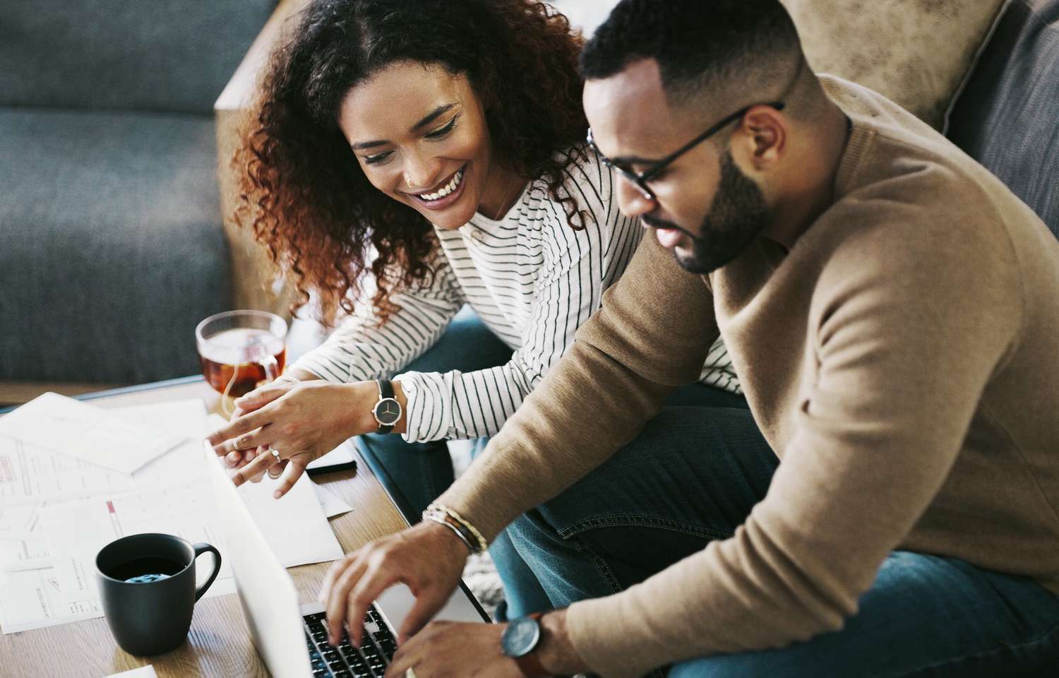 A couple looks over their FHA loan offer.