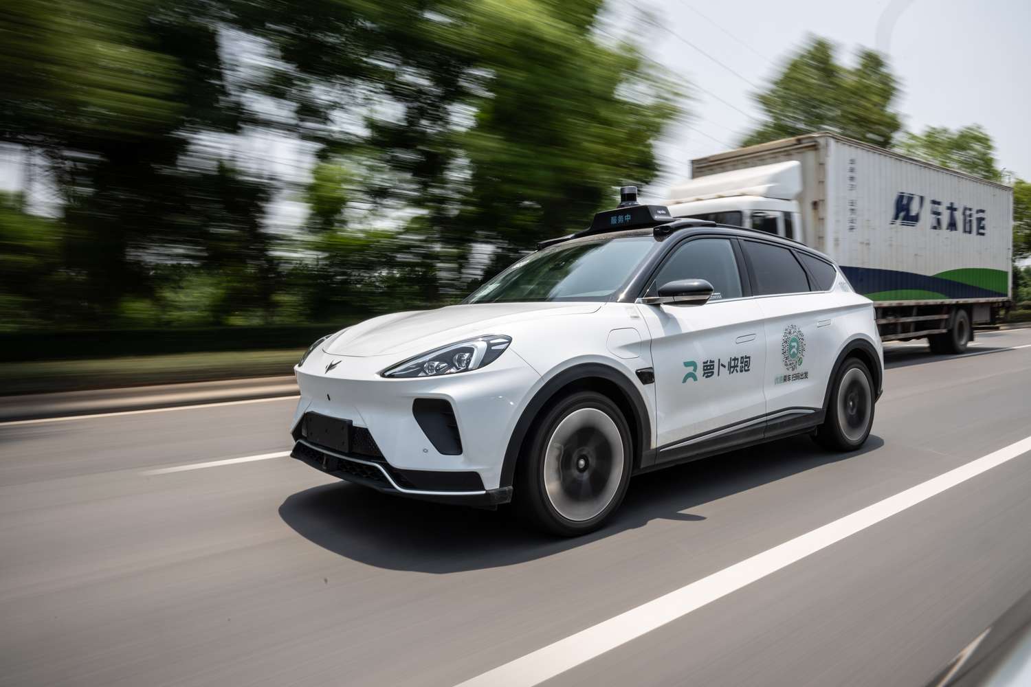 A Baidu Inc. Apollo RT6 robotaxi travels on a road during Baidu's Apollo Day in Wuhan, China, on May 15, 2024