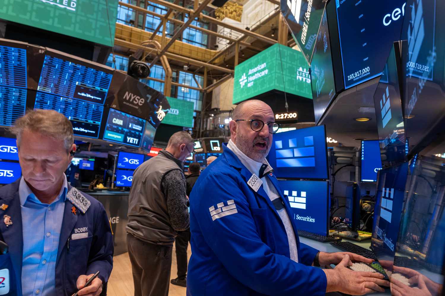 Traders work on the floor at the New York Stock Exchange 